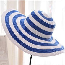 Load image into Gallery viewer, Black and white striped straw hat along the beach
